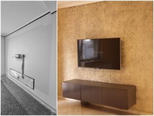 Bézs lemezes, sziklás kőhatású fal TV-falként kialakítva egy modern nappaliban – természetes hatású, kézzel formált felület prémium enteriőrbe, nappali díszfalnak vagy médiafalhoz.
